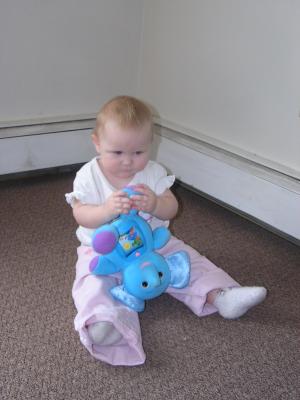 Sarah plays with her new elephant.
