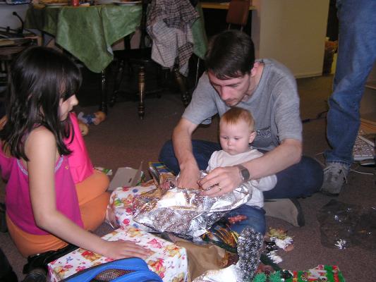 Sarah and David open presents.