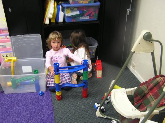 Mickala and Andrea play in the Nursery.