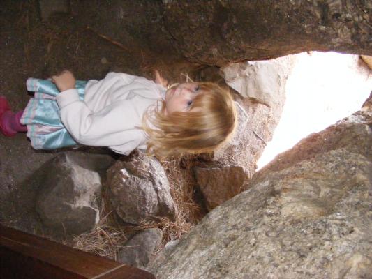 Sarah plays between rocks.