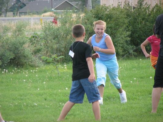 Breanna running with the kids.