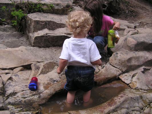Noah has a bunch of little rocks on his bottom.