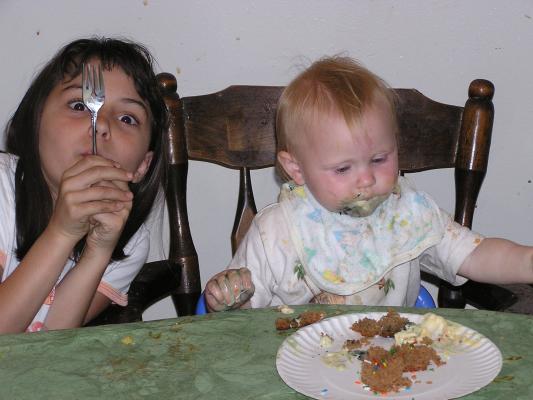 Malia and Sarah eat some birthday cake.