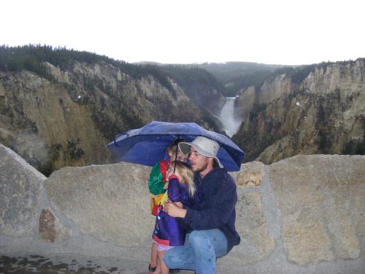 David and kids under umbrella