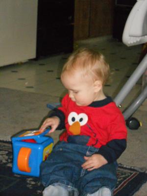 Joshua plays with his Jack in the Box. 