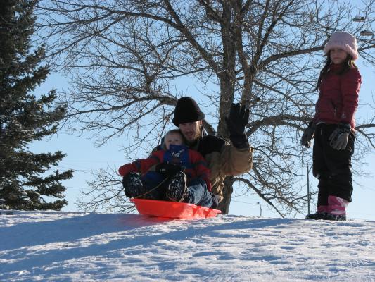David and Sarah go down the hill.