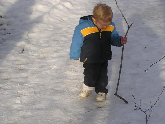 Noah admires his great stick.