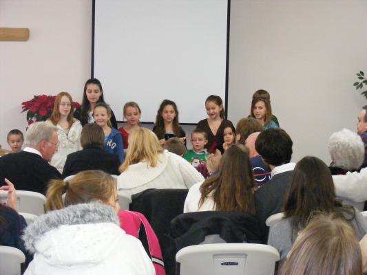 children singing at church.
