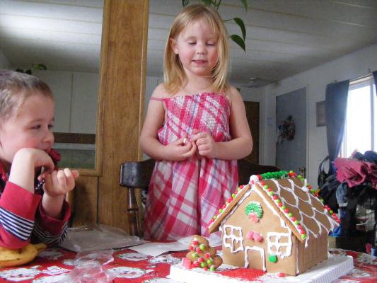 Noah and Sarah admire their house.