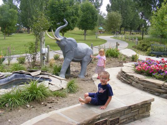 Sarah and Noah by the elephant sculpture.