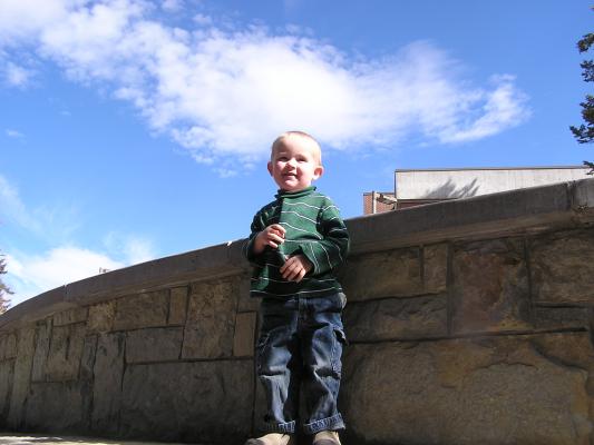 Noah climbs the wall.