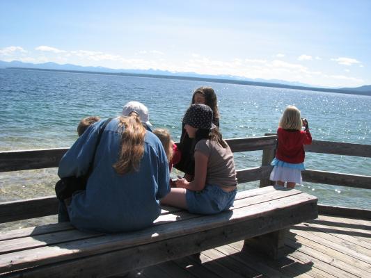 Kids resting on a bench