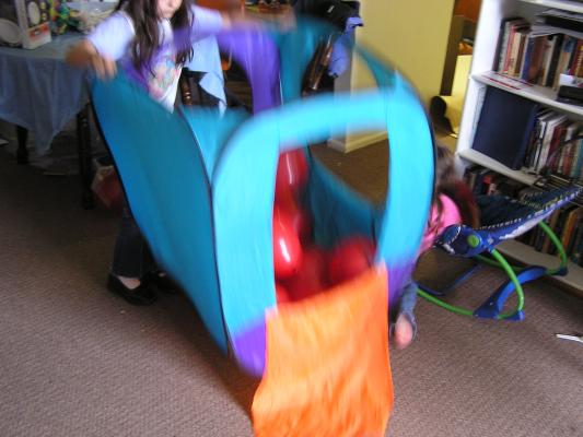 Malia plays with balloons.