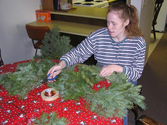 Katie makes a Christmas wreath.