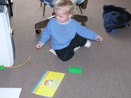 Noah plays with an advertizement.