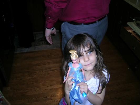 Andrea shows off her action figure.