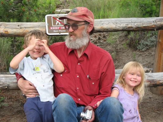 Noah and Sarah with Grandpa. Noah seems to think bears hold their hands in front of their faces.
