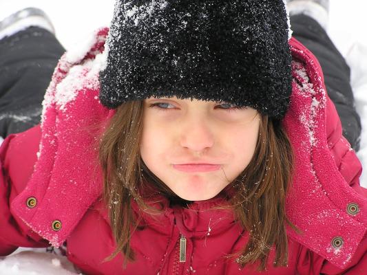 Andrea plays in the snow.