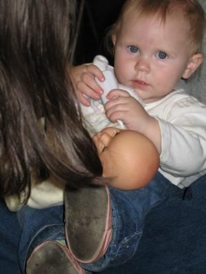 Sarah feeds her baby.