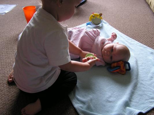 Noah gives Sarah her pacifier.