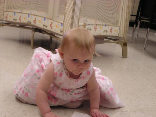 Sarah plays on the floor.
