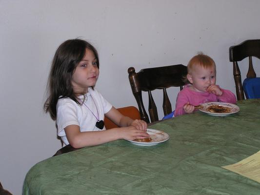 Andrea and Sarah eat some toast.