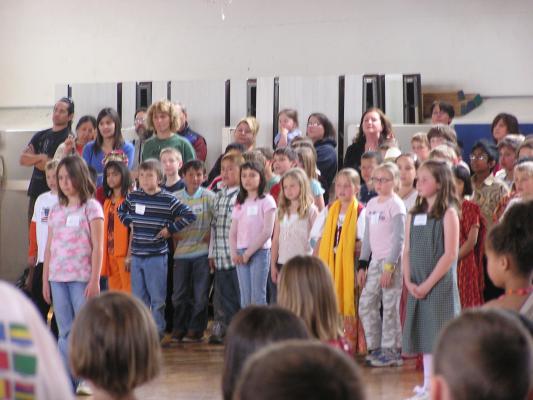 Malia singnig with her school.