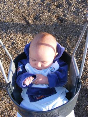 Joshua's first time in a park swing.