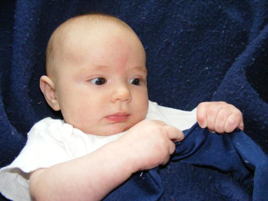 Joshua in a blue blanket.