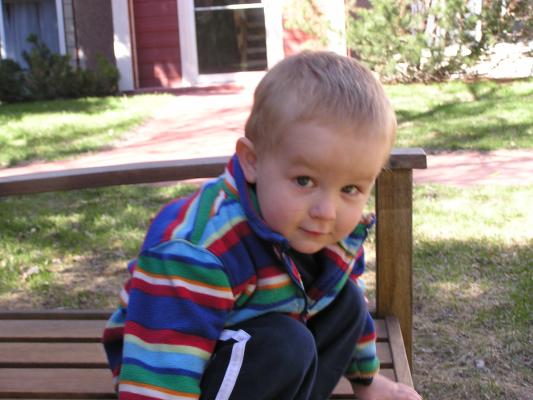 Noah plays on the bench.