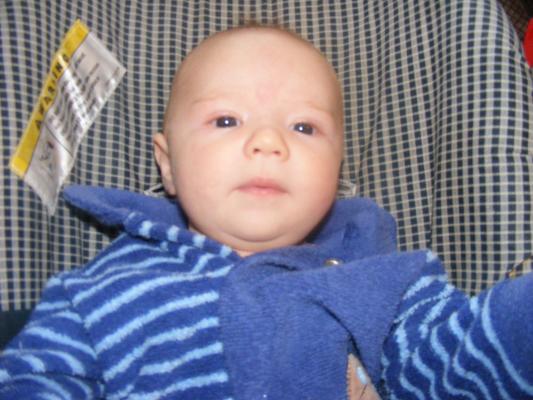 Joshua hanging out in his car seat.