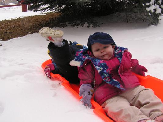 Noah's foot and Sarah in the sled.