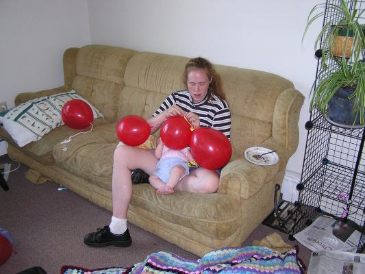 Katie and Sarah play with the red balloons.