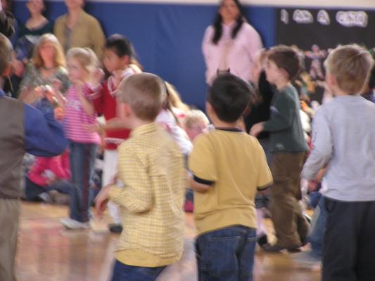 kindergarten and first graders perform for international day.