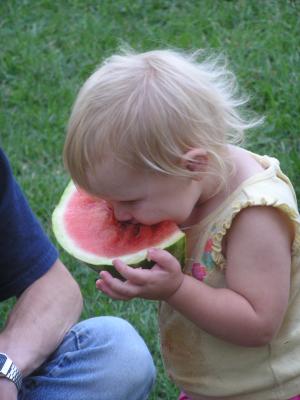 Sarah eats some watermelon.
