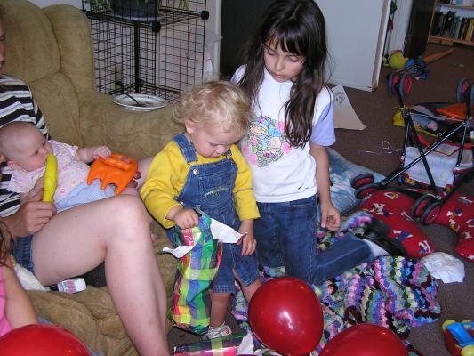 Noah rips some wrapping paper.