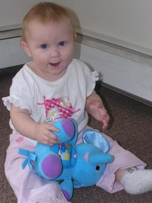 Sarah plays with her new elephant.