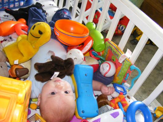 Noah got all the baby toys for Joshua to play with.