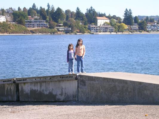 Andrea and Malia hold hands.