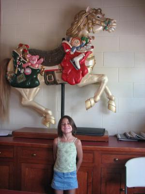 Andrea by a carousel horse.