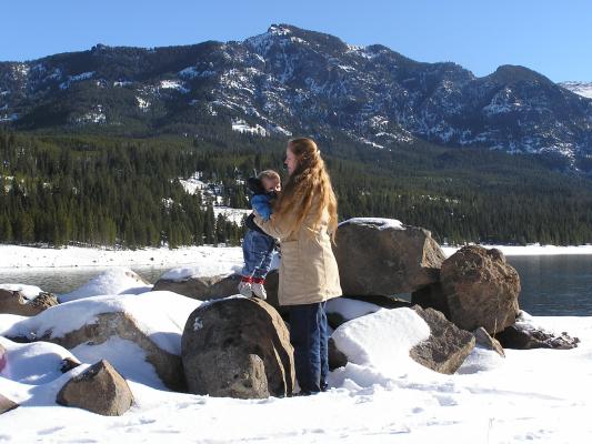 Katie and Noah play on some rocks.