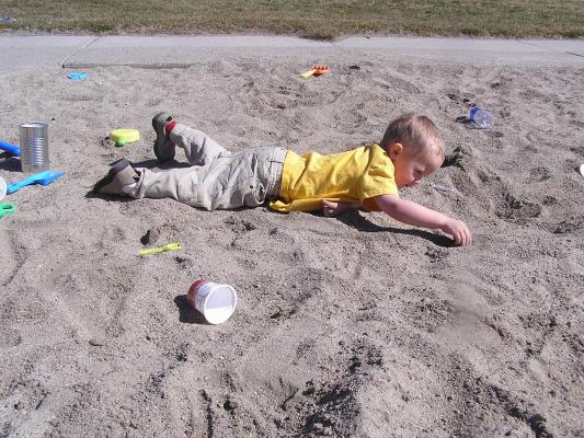 Noah plays inthe sand