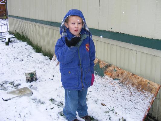 Noah eats the first snow