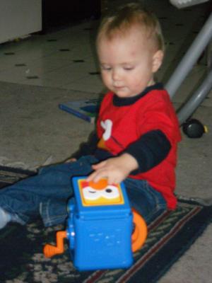 Joshua shuts his Jack-in-the-box. 