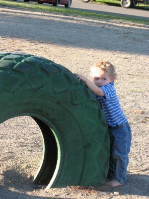 Noah by the green tire