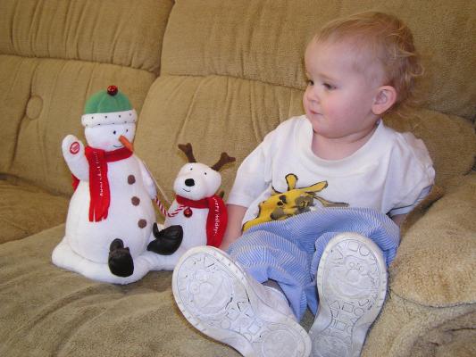 Noah plays with his singing snow man.