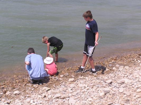David Sarah Tanner and Danny play in the lake.