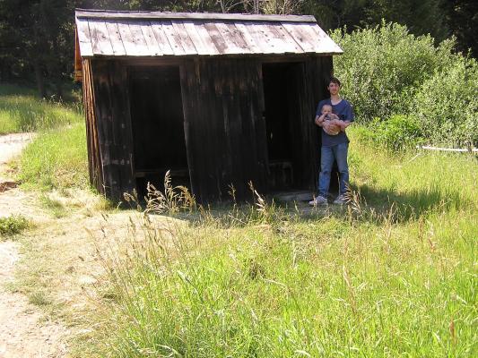David and Noah out by the outhouse.