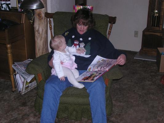 Sheley reads to Sarah.