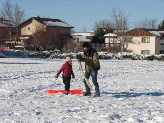 Andrea and David sledding.